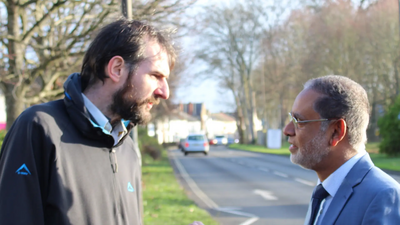 Image courtesy of Rushmoor Liberal Democrats Alain Dekker and Cllr Abul Koher Chowdhury discuss the effect of Conservative cuts on local groups.
